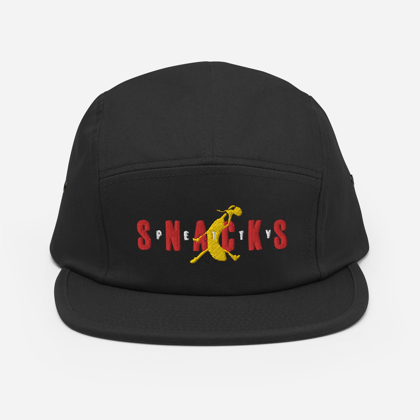 Black five panel hat, front panel has embroidered graphic. "Petty Snacks" with a jumpan inspired logo that is a yellow banana duking a bong. The word "Snacks" is big and spread across front in red. The word "PETTY" is small lettering, with each letter in between the letter of "Snacks" and over the banana. Logo is inspired by jumpman graphic