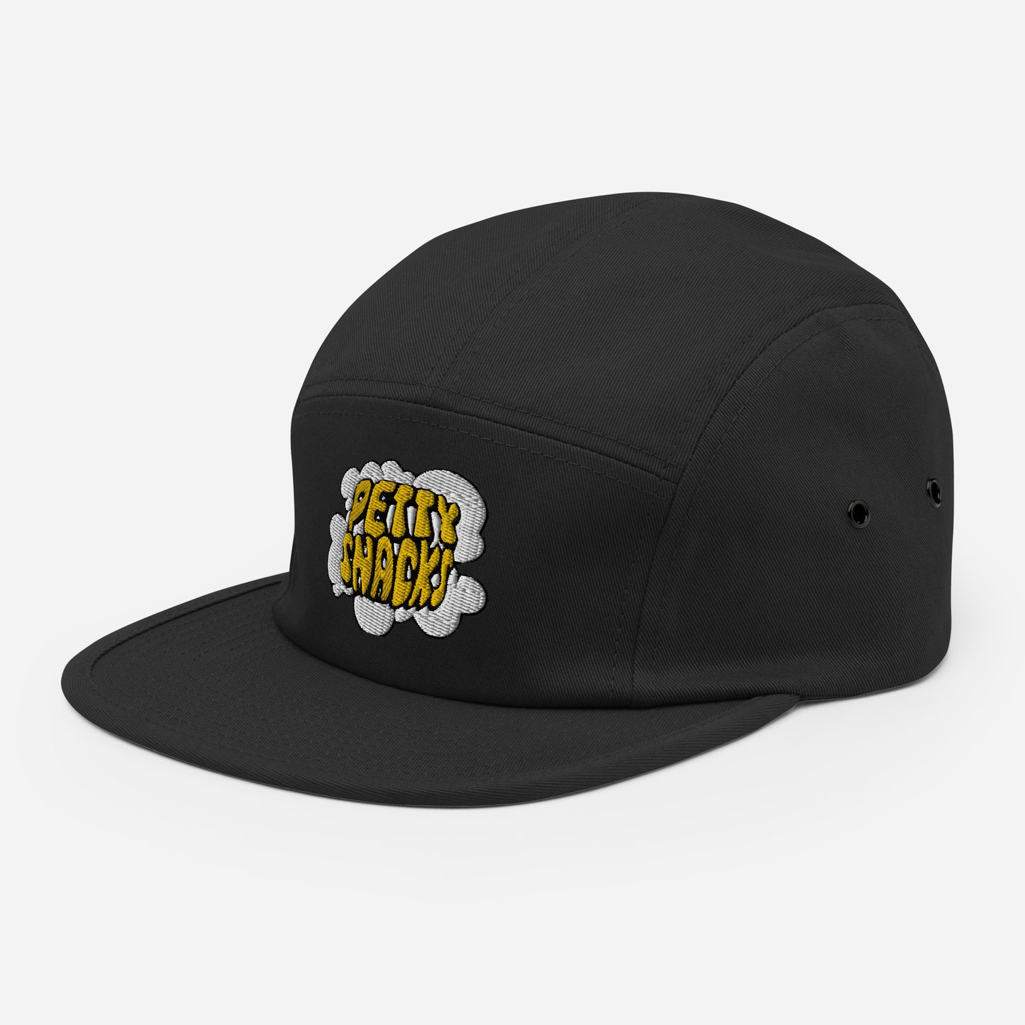 Side view of a black five panel hat, embroidery on front center. Embroidery of white smoke cloud, yellow lettering in cloud reads "Petty Snacks" with a black outline.